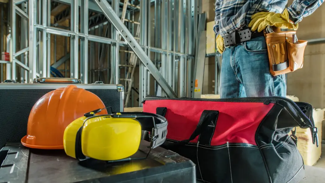 JHA or Job Hazard analysis represented by a HSEQ professional checking what tools he has to address upcoming risks.