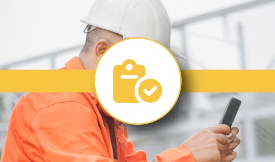 Construction professional using FlexManager Audits and Inspections module dashboard to view compliance checklists, inspection schedules, and audit status for effective health and safety management.