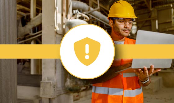 Safety manager using FlexManager mobile app for on-site health and safety risk assessment and hazard reporting.