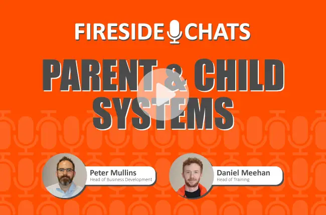 Professionals in a fireside chat explaining the concept of parent and child systems in HSEQ software.