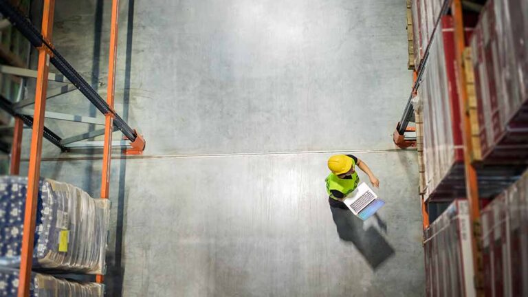 Lone Worker in comprehensive PPE on an empty site, symbolizing the need for robust lone worker protection and communication protocols.