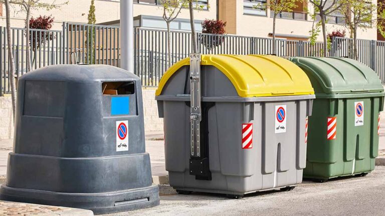 Responsible waste disposal into recycling bins, demonstrating efficient waste management for HSEQ standards using the FlexManager waste tracking tool.