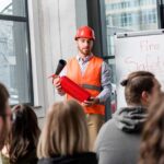 Presenters for fire safety week providing details on how to take preventative action during fire safety week.