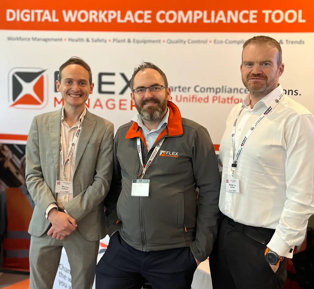 FlexManager representatives at the NISO conference 2025 where they exhibited and demonstrated their compliance software solution to experts,