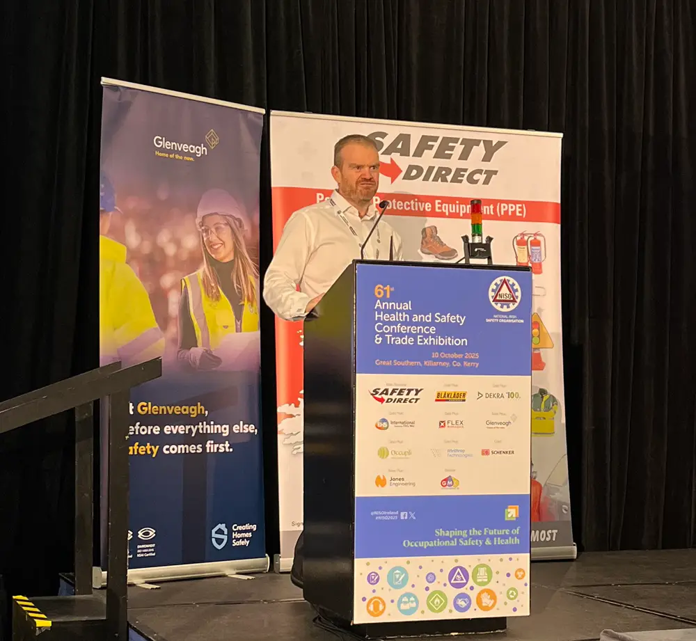Safety professional conducting a talk on Real compliance in a Digital Transformation to NISO attendees at an annual conference.