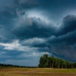 Storm clouds on an open landscape that represents the current orange weather warning in Ireland.