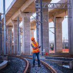 Professional inspecting infrastructure as part of national action plan.