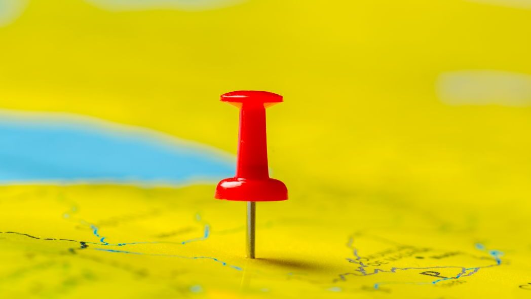 Geolocation represented by a pin on a map.