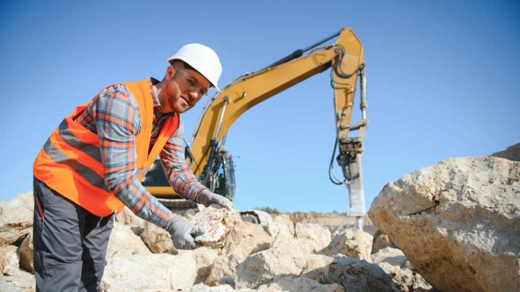 Quarry worker abiding by new health and safety regulations as enacted for 2026.