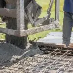 Low carbon concrete being poured by professionals for long-term projects.