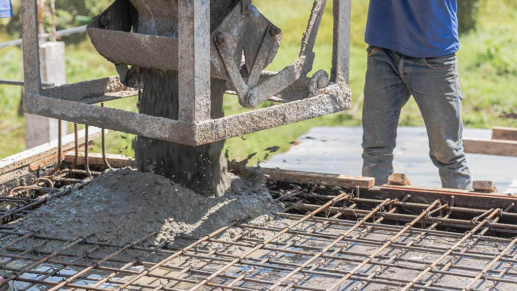 Low carbon concrete being poured by professionals for long-term projects.