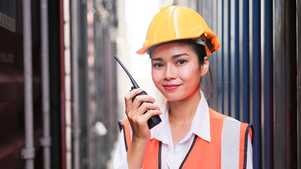 Site supervisor that values communication, represented by use of a radio on-site.