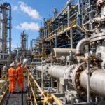 Industrial refinery pipework and steel infrastructure representing the importance of asset integrity management, planned maintenance, and inspection scheduling after the Esso Fawley HSE prosecution.