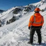 Search and rescue team responding to an avalanche linked to alleged workplace safety violations