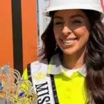 Female construction health and safety officer on site wearing a hard hat and high vis