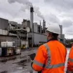 Industrial facility exterior representing a Minnesota manufacturer fined for air permit and waste management violations.