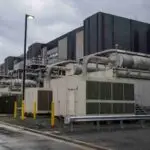 Data centre exterior with emergency generators running, representing the emissions penalty issued against a Microsoft facility in Virginia.