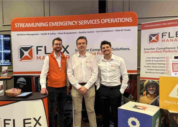 FlexManager team at the Emergency Services & Military Expo in Athlone, discussing fire and rescue compliance software