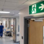 Fire exit signage highlighting fire safety concerns raised in a hospital compliance inspection